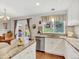 Bright kitchen features stainless steel appliances and granite countertops at 9774 Burberry Way, Highlands Ranch, CO 80129