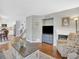 Open concept living area adjacent to kitchen and stairwell at 9774 Burberry Way, Highlands Ranch, CO 80129