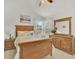 Bright main bedroom with large window and traditional decor at 9774 Burberry Way, Highlands Ranch, CO 80129