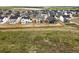 Wide aerial view of a neighborhood showcasing a variety of homes and green spaces at 39713 Penn Rd, Elizabeth, CO 80107