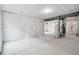 Unfinished basement showing the framing, water heater, and ready for customization at 39713 Penn Rd, Elizabeth, CO 80107
