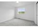 Bedroom featuring neutral paint, carpet, and a bright window at 39713 Penn Rd, Elizabeth, CO 80107