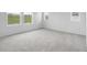 Spacious bedroom with plush carpeting and ample natural light from multiple windows at 39713 Penn Rd, Elizabeth, CO 80107