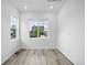 Bright bedroom with hardwood floors, large windows, and neutral paint at 39713 Penn Rd, Elizabeth, CO 80107