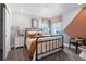 Cozy bedroom featuring stylish decor, natural light, and a view to the outdoors at 39713 Penn Rd, Elizabeth, CO 80107