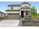 Charming two-story home featuring stone accents, a two-car garage, and a well-maintained front yard at 39713 Penn Rd, Elizabeth, CO 80107