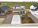 Aerial view of a two-story home featuring a well-manicured front yard and neutral exterior paint at 39713 Penn Rd, Elizabeth, CO 80107