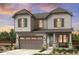Charming two-story home featuring a two-car garage, stone accents, and a well-maintained front yard at 39713 Penn Rd, Elizabeth, CO 80107