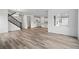 Bright living room featuring hardwood floors, large windows, and an open floor plan at 39713 Penn Rd, Elizabeth, CO 80107