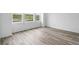 Bright living room featuring hardwood floors and large windows at 39713 Penn Rd, Elizabeth, CO 80107