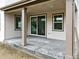 Covered patio providing an outdoor space with a view of the home's backyard through sliding glass doors at 39713 Penn Rd, Elizabeth, CO 80107