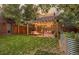 Charming backyard with pergola, string lights, and colorful outdoor seating, ideal for relaxing and entertaining at 944 S Euclid Way, Denver, CO 80209