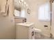 Well-lit bathroom offers a sleek vanity, classic fixtures, and a clean, functional design for everyday comfort at 944 S Euclid Way, Denver, CO 80209