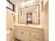 Clean bathroom features a well-lit mirror, ample counter space, and a simple functional layout at 944 S Euclid Way, Denver, CO 80209