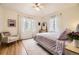 Inviting bedroom with a plush rug, large windows, and comfortable seating for a relaxing retreat at 944 S Euclid Way, Denver, CO 80209