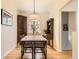 Inviting dining room featuring a marble-top table, classic furnishings, and hardwood floors for a cozy ambiance at 944 S Euclid Way, Denver, CO 80209