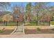 Charming brick home with a manicured front yard, a stone wall, and a wrought iron fence showcasing curb appeal at 944 S Euclid Way, Denver, CO 80209