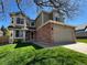 Charming two-story home featuring a well-manicured lawn and a two-car garage, perfect for suburban living at 11636 Laurel Ln, Parker, CO 80138
