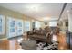 Bright basement Gathering room with French doors leading outside at 6517 Perry Park Blvd, Larkspur, CO 80118