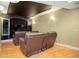 Finished basement with home theater setup and leather recliners at 6517 Perry Park Blvd, Larkspur, CO 80118