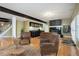 Finished basement featuring wet bar and comfortable lounge area at 6517 Perry Park Blvd, Larkspur, CO 80118