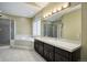 Elegant bathroom with double vanity, soaking tub, and separate shower at 6517 Perry Park Blvd, Larkspur, CO 80118