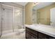 Clean bathroom with dark vanity and walk-in shower at 6517 Perry Park Blvd, Larkspur, CO 80118