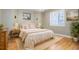 Charming bedroom with hardwood floors and a neutral color scheme at 6517 Perry Park Blvd, Larkspur, CO 80118