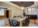 Open dining room with a large farmhouse table at 6517 Perry Park Blvd, Larkspur, CO 80118