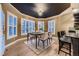 Bright dining room with large windows and hardwood floors at 6517 Perry Park Blvd, Larkspur, CO 80118