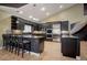 Gourmet kitchen with dark wood cabinets, granite countertops, and stainless steel appliances at 6517 Perry Park Blvd, Larkspur, CO 80118