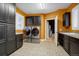 Bright laundry room with ample cabinet space and washer/dryer hookups at 6517 Perry Park Blvd, Larkspur, CO 80118