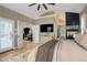 Main bedroom with large windows and ensuite bathroom at 6517 Perry Park Blvd, Larkspur, CO 80118