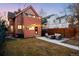 Exterior shot of home and yard with string lights and modern outdoor patio furniture at 2844 N Humboldt St, Denver, CO 80205