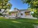 Picture of a well manicured backyard showing the exterior of the home at 588 Stafford Cir, Castle Rock, CO 80104