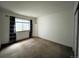 Bedroom featuring neutral carpet, a window and custom curtains at 588 Stafford Cir, Castle Rock, CO 80104