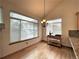 Well-lit dining area showcasing a chandelier, hardwood floors and large windows at 588 Stafford Cir, Castle Rock, CO 80104