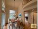 Formal dining room featuring high ceilings, large window, and neutral decor creating a warm and inviting atmosphere at 588 Stafford Cir, Castle Rock, CO 80104