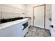 A laundry room with new appliances and ample shelving at 588 Stafford Cir, Castle Rock, CO 80104