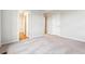 Spacious bedroom featuring soft carpeting and an open doorway to another room at 19018 E 94Th Pl, Commerce City, CO 80022