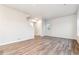 Bright and open living space with hardwood floors, a staircase, and a view of the upstairs landing at 19018 E 94Th Pl, Commerce City, CO 80022