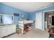 Bright bedroom featuring a bunk bed, dresser, and neutral carpet at 4165 S Granby Cir, Aurora, CO 80014