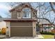 Charming two-story home with a two-car garage, brick accents, and beautiful landscaping at 4165 S Granby Cir, Aurora, CO 80014