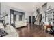 Bright living room with hardwood floors, two couches, and lots of natural light at 4165 S Granby Cir, Aurora, CO 80014