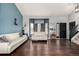 Bright living room with hardwood floors, two couches, and lots of natural light at 4165 S Granby Cir, Aurora, CO 80014