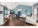 Spacious living room with hardwood floors, dining area, and lots of natural light at 4165 S Granby Cir, Aurora, CO 80014