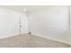 Bright bedroom with neutral carpet, white walls, and natural light from a window at 1219 Lilac Dr, Lochbuie, CO 80603