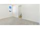 Bedroom features neutral carpet and ensuite bathroom at 1219 Lilac Dr, Lochbuie, CO 80603