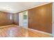 Bedroom with hardwood floors, traditional wood paneling and plenty of natural light at 1219 Lilac Dr, Lochbuie, CO 80603