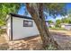 Charming one-story home featuring white siding and well-established trees with ample shade at 1219 Lilac Dr, Lochbuie, CO 80603